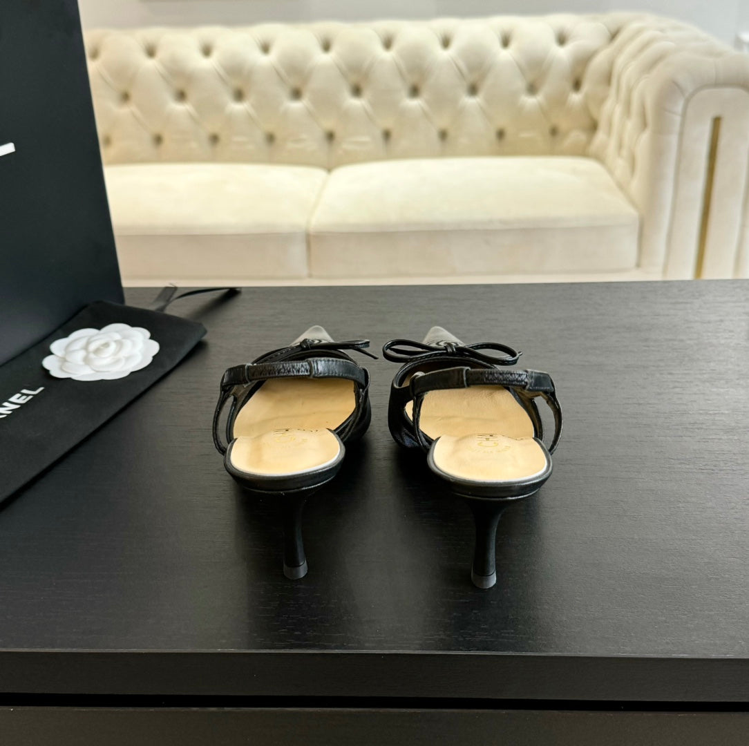 CHANEL MESH LOGO SLINGBACKS IN BLACK LAMBSKIN