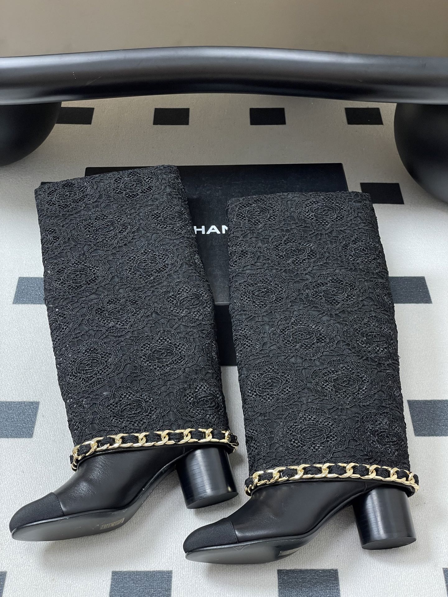 CHANEL FLORAL BOOTS 60MM IN BLACK CALFSKIN WITH GOLD CHAIN